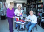 Dr. Kenan Atakol signing his books